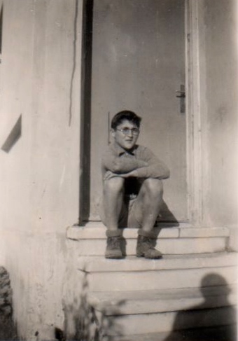 Poomy at age 13 seating in front of his house @ 3 Ben Gurion Ave (Shderot Kern Kayemet)
